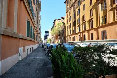 a city street with parked cars and buildings at Casa Frida Arte e Sport tra MAXXI e Olimpico in Rome