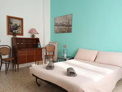 a bedroom with a bed and a piano at Bed Bike Breakfast al centro di Roma in Rome