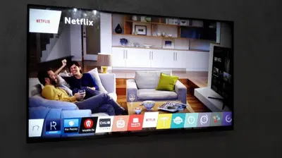 a tv screen with a man and woman sitting on a couch at Luxury Rome Savini Guest House in Rome