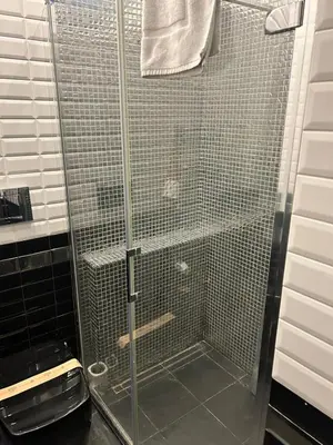 a shower with a glass door in a bathroom at Guest House Sinfonia sul Tevere in Rome