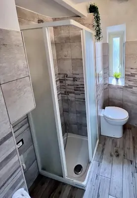 a bathroom with a shower and a toilet at FlowflatPigneto in Rome