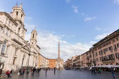 a group of people walking around a city street at Casa degli Spagoli Navona Square in Rome