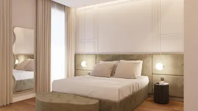 a bedroom with a large white bed with a stool at 56 Orange Street Luxury Accommodation in Rome