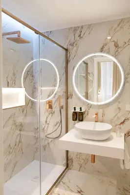 a bathroom with a sink and a mirror at 56 Orange Street Luxury Accommodation in Rome