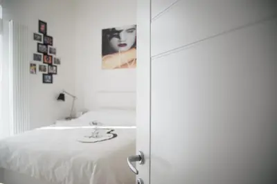 a bedroom with a bed and a picture on the wall at Big Johnny B in Rome
