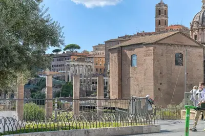 a street in front of a large building at Exentia Stays - Luxury Apartment Colosseum in Rome