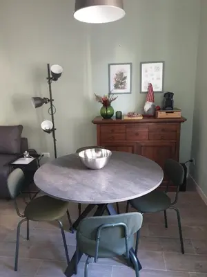 a dining room with a table and chairs at Appartamento La Doriana in Rome