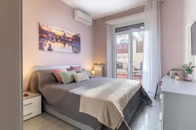 a bedroom with a bed and a window at Casa Gabea in Rome