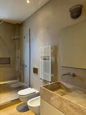 a bathroom with two toilets and a sink at Elegante appartamento con terrazzo in Rome