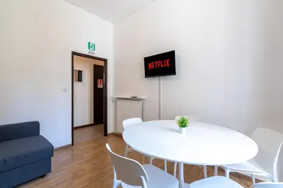 a living room with a white table and chairs at Typical & Cozy Apartment - Testaccio - Trastevere in Rome