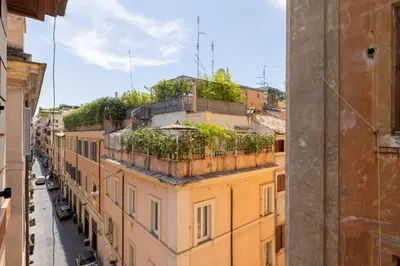 an apartment building with plants on top of it at Maurice's Apt, hidden gem in Rome for food lovers in Rome