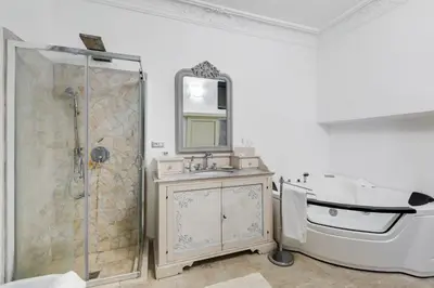 a bathroom with a tub and a sink and a shower at Suite Experience Spanish Steps Apartment in Rome