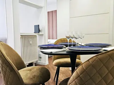 a table with plates and wine glasses on it at Via Aubry 1- Vatican Museum in Rome