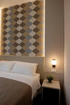 a bedroom with a bed and a painting on the wall at DoppioSei in Rome