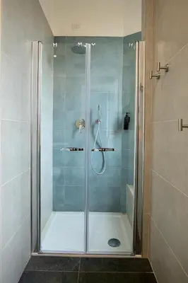 a shower with a glass door in a bathroom at DoppioSei in Rome