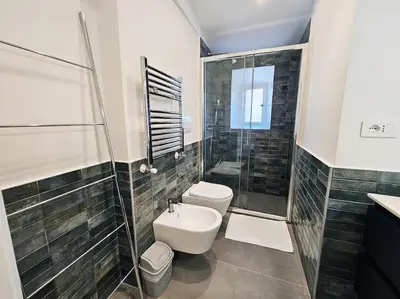 a bathroom with a shower and a toilet and a sink at Gabri 19 - Elegant Escape in Piazzale Flaminio in Rome