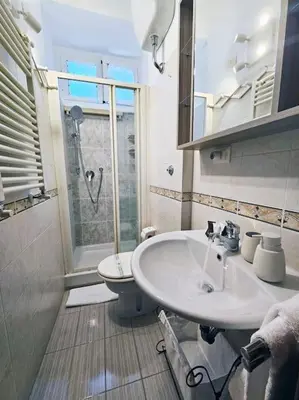 a bathroom with a sink and a toilet at Vicolo di Monte del Gallo 24 - Vatican City in Rome