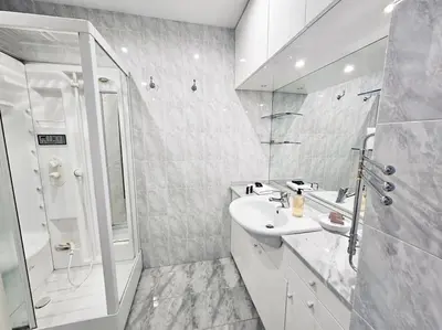 a white bathroom with a sink and a shower at Carlo Rusconi 10 - Trastevere in Rome