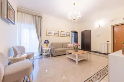 a living room with a couch and a table at St Peter's Comfort Lodge in Rome