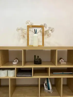 a wooden shelf with some items on it at Dandon Home in Rome