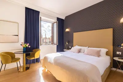a hotel room with a large bed and a window at Navona 49 Luxury Suites&Apartment in Rome