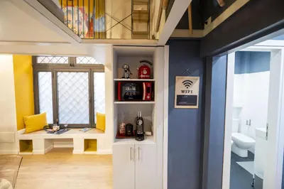 a bathroom with a sink and a toilet in a room at Design and Colorful Loft near Villa Pamphili in Rome