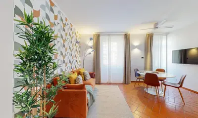 a living room with a couch and a table at Valery - Appartamento Glam vicino al Vaticano in Rome