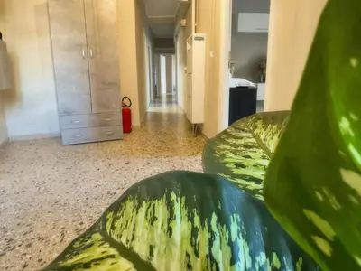 a room with a couch and a dresser at Vatican Comfortable 5 Bedroom Flat - 6 min METRO A by ORPI RENT in Rome