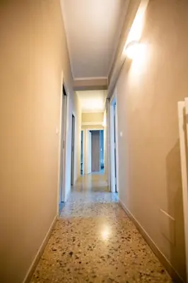an empty corridor of an empty room with a hallway at Vatican Comfortable 5 Bedroom Flat - 6 min METRO A by ORPI RENT in Rome
