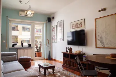 a living room with a couch and a table at Olimpico Apartment in Rome