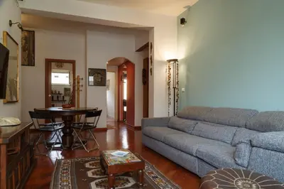 a living room with a couch and a table at Olimpico Apartment in Rome