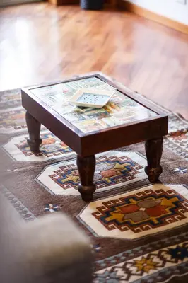 a coffee table sitting on top of a rug at Olimpico Apartment in Rome