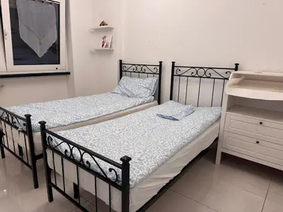 two beds sitting next to each other in a bedroom at GIUBILEO PALACE Inn in Rome