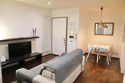 a living room with a couch and a television at Piramide Experience in Rome