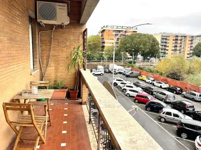 a balcony with a view of a parking lot at Piramide Experience in Rome