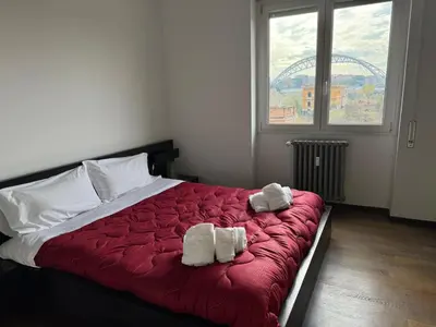 a bedroom with a bed with two towels on it at Piramide Experience in Rome