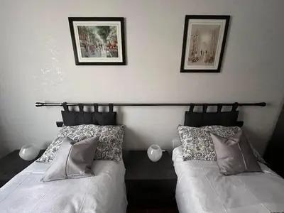 two beds sitting next to each other in a bedroom at ALGA Roma in Rome