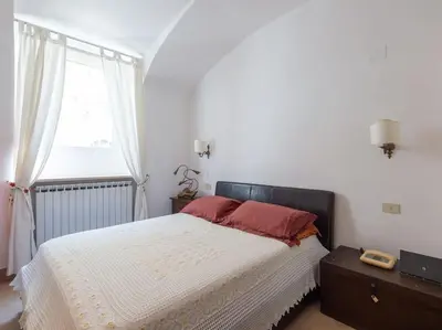 a bedroom with a large bed and a window at Central Station Enchanting Apartments in Rome