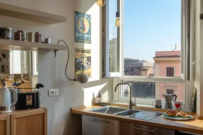 a kitchen with a sink and a window at Esquilino Dream in Rome