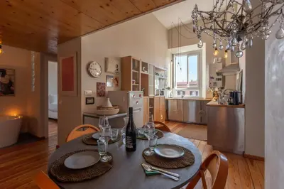 a kitchen and dining room with a table and chairs at Esquilino Dream in Rome