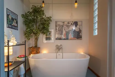 a bath tub in a room with lights at Esquilino Dream in Rome