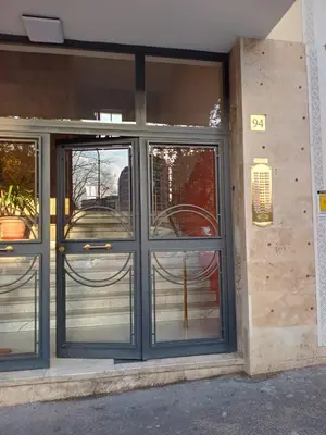 an entrance to a building with glass doors at Soraya Home in Rome