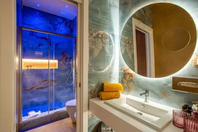 a bathroom with a sink and a mirror at VentiSettembre Private Suites in Rome