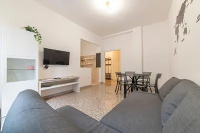 a living room with a couch and a table at Trastevere - Monteverde Apartment in Rome