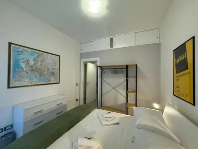 a bedroom with a bed and a map on the wall at Urban Oasis Near Appia Antica Park in Rome