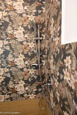a shower in a bathroom with a floral wallpaper at Sophie's choice 3 e Sophie's choice 4 in Rome