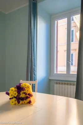 a bouquet of flowers sitting on top of a table at Sophie's choice 3 e Sophie's choice 4 in Rome