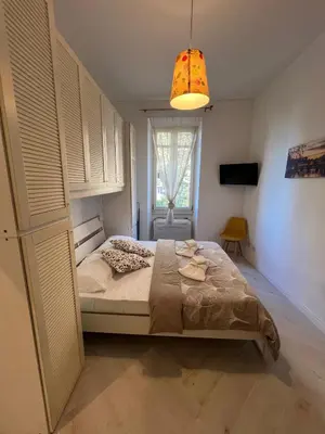 a bedroom with a bed and a window at Maison Trionfale a 2 passi dal Vaticano in Rome