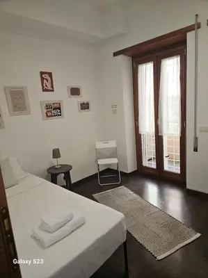 a bedroom with a bed with towels on it at St Peter central apartment in Rome