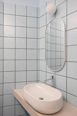 a white bathroom with a sink and a mirror at 4BNB - Suites del Gallo in Rome
